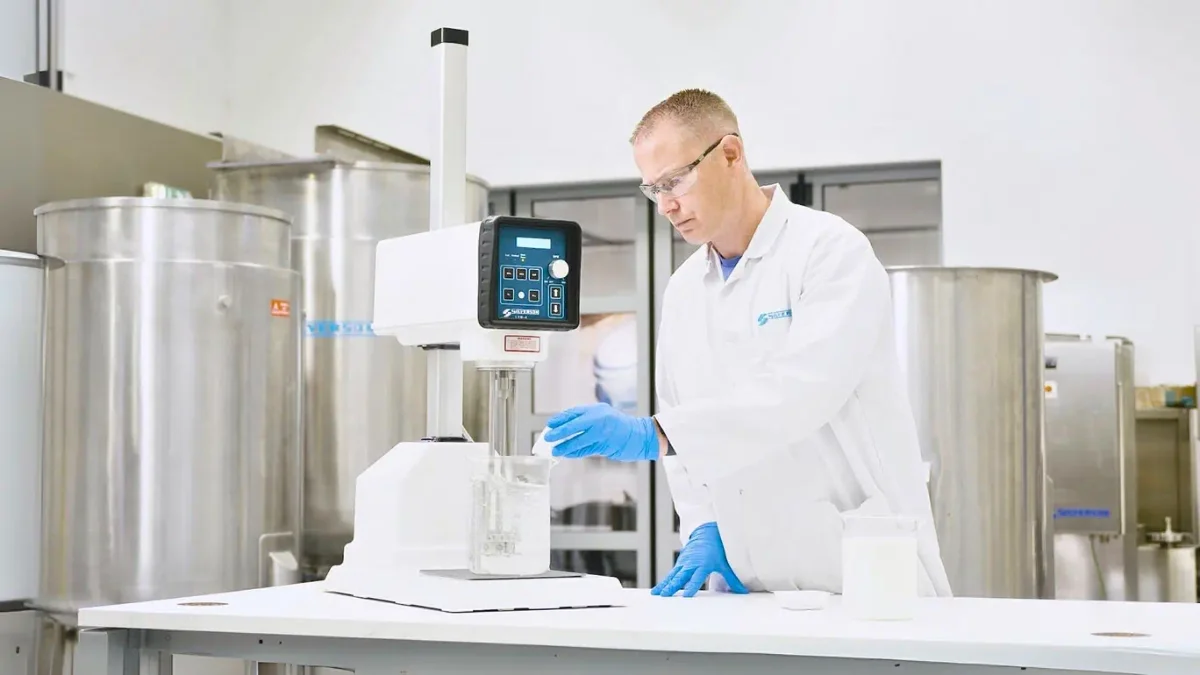 Technician operating a Silverson laboratory high shear mixer